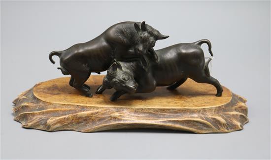 A Japanese bronze group of two fighting bulls, signed Seiya saku, Meiji length 17cm